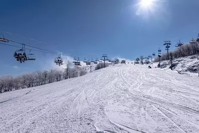 snowy trail with chairlift