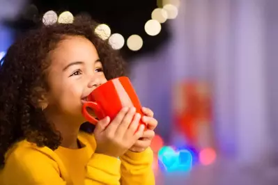 child drinking hot choclate