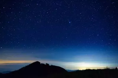 The night sky seen from a cabin's private deck at Mountain Country Cabin Rentals.