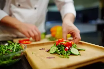 person cutting up food