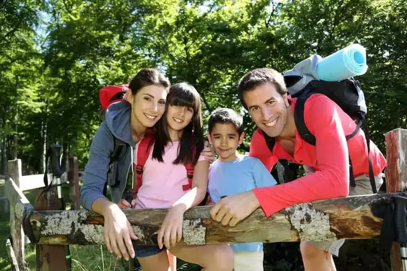 A happy family on a hike in nature.