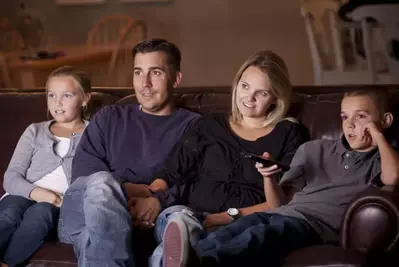 Family watching movie together