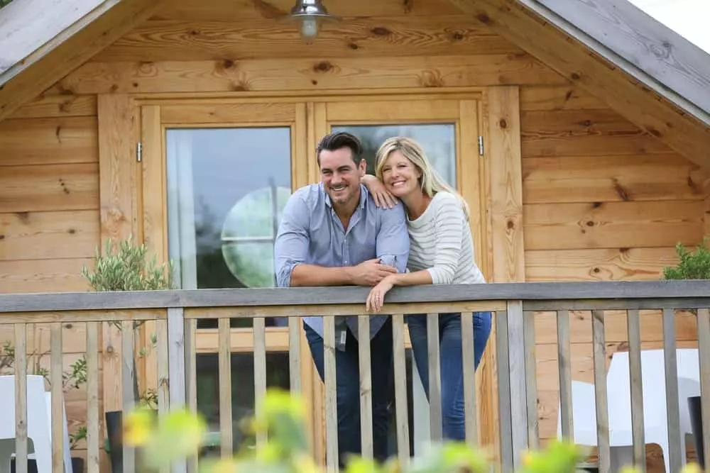 Romantic couple on the deck of a cabin.