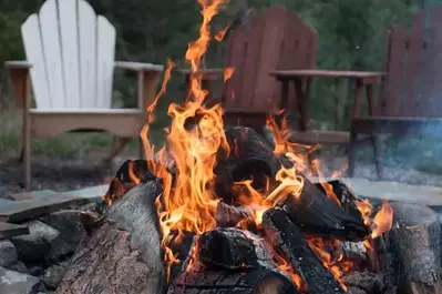 A firepit with chairs around it.