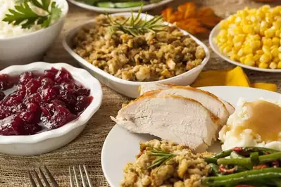 A table filled with various Thanksgiving foods.