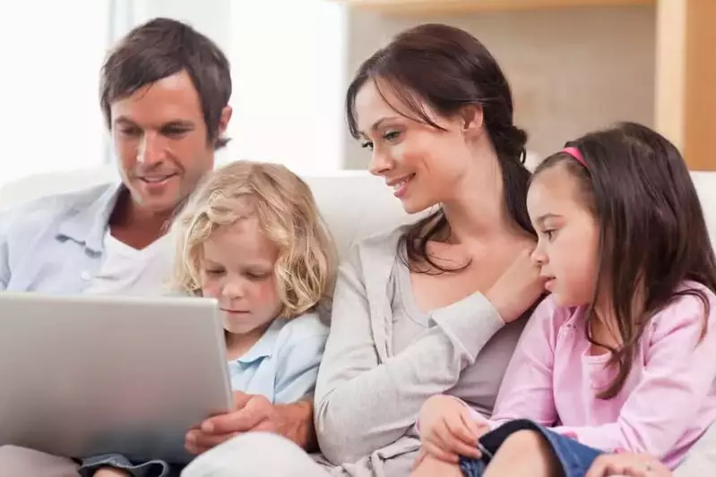 Family surfing the web together on a tablet in their Murphy NC cabin with internet access.