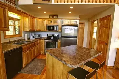 The lovely kitchen of a cabin rental in Murphy North Carolina.